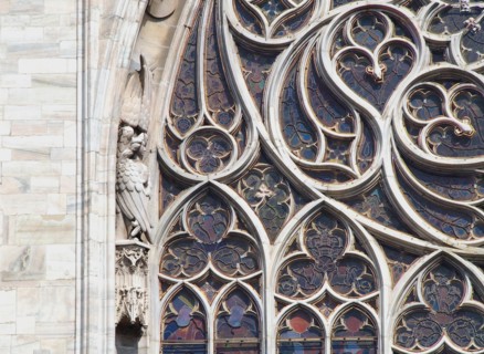 Detail of a stained glass window at Notre Dame cathedral in Paris, France.