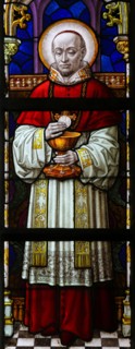 Stained Glass window in St Gummarus Church in Lier, Belgium, depicting a Cardinal holding a Host for Holy Communion