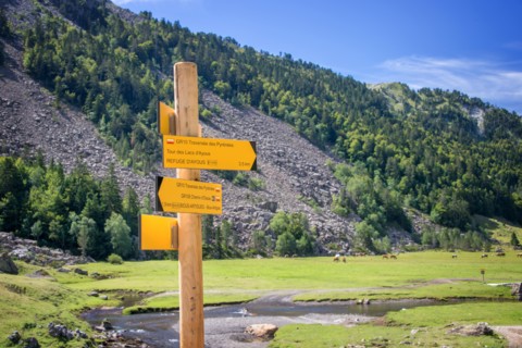 Hiking direction sign in Ossau Valley, Pyrenees, France