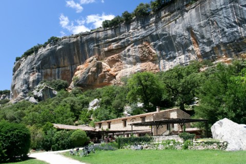 Buoux, France - June 26 2007: cyclists eat in restaurant of Auberge under the cliffs of the buoux fort, France. Auberges are rural Inns typically with