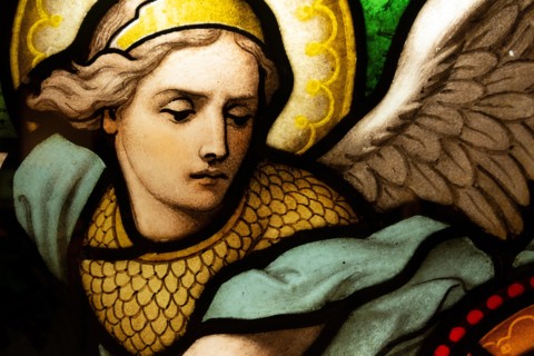 Detail of a stained glass window depicting an angel.
