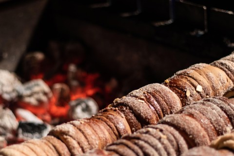 Close-up image of a typical Czech dessert called trdelnik in preparation