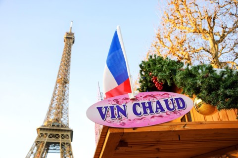 PARIS, FRANCE - DECEMBER 26, 2015: Hot mulled wine ("vin chaud" in French) for sale Christmas market near Eiffel tower.