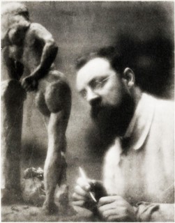 Old photo / portrait of the world famous artist, Henri Matisse sculpturing