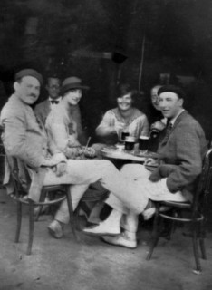 PAMPLONA, SPAIN - July 1925 - Ernest Hemingway with Lady Duff Twysden, Hadley Hemingway, and three unidentified people at a cafe in Pamplona, Spain, d