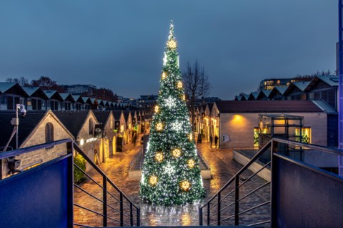 Paris, France - December 9, 2020: Beautiful Christmas tree in Bercy Village (cour Saint-Emilion) in Paris, France