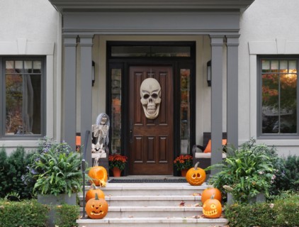 Halloween decorations on front porch and steps of house