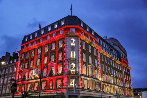London, UK. 18th Nov, 2024. The annual 'advent calendar' facade decorations and 2024 display glows in festive red on the Fortnum and Mason building in Piccadilly. Christmas Lights, baubles and elabora...