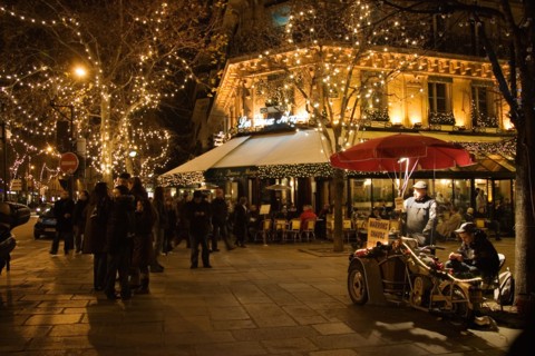 Roasted chestnut street seller outside Les Deux Magots Cafe and Restaurant Boulevard St Germain Paris France