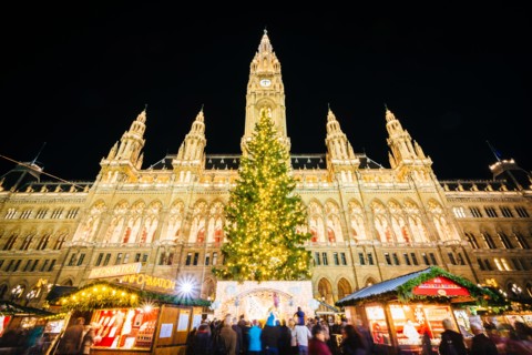 Christmas Market and Rathaus at night, at Rathausplatz, in Vienna, Austria.