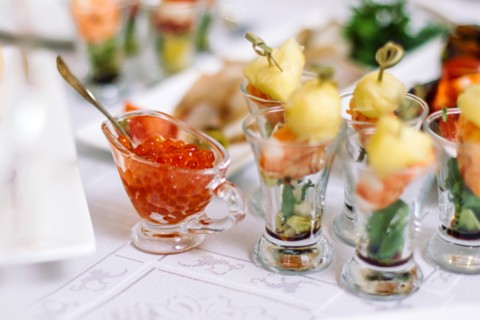 red caviar in a decorative plate on the christmas table.