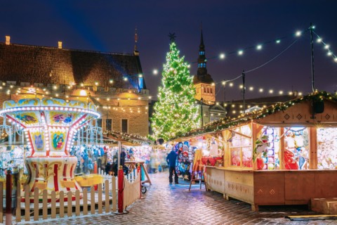 Tallinn, Estonia. Traditional Christmas Market On Town Hall Square. Christmas Tree And Trading Houses. Happy New Year Holiday.