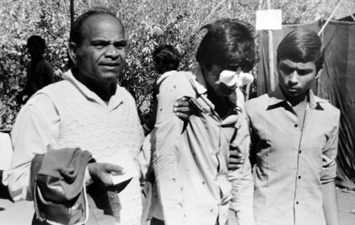 Father with son eyes bandage damaged , Bhopal , Madhya Pradesh , India , Asia