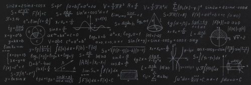 Formulas and calculations from mathematics and geometry on school blackboard