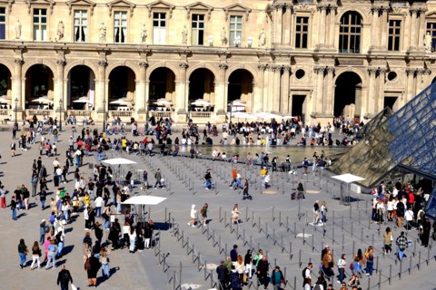 People preparing to enter the Louvre Museum in Paris France