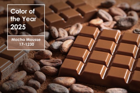 Sweet chocolate with cocoa beans, closeup. Mocha Mousse - color of year 2025