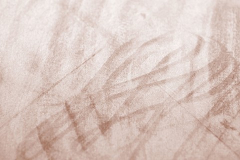 Mocha-Mousse fabric texture with light scuff marks, highlighting the Pantone Color of the Year 2025.