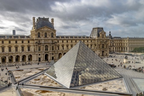 The Louvre Pyramid is a large glass-and-metal structure The pyramid  and serves as the main entrance to the Louvre Museum in Paris, France