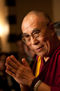 Dalai Lama Tenzin Gyatso, speaking at a function.