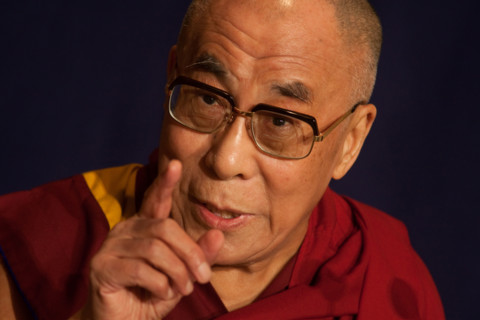 Dalai Lama Tenzin Gyatso, speaking at a function.