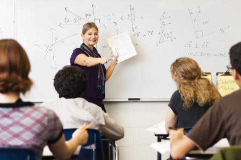 Woman teaching geometry class