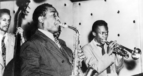 CHARLIE PARKER in middle with fellow US jazz musician Miles Davis