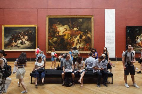 Visitors in front of the painting 'Death of Sardanapalus' (1827-1828) by French Romantic painter Eugène Delacroix displayed at his retrospective exhibition in the Louvre Museum in Paris, France. The e...
