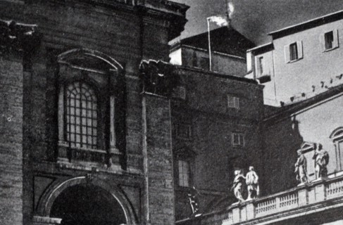 Black and white photograph of white smoke coming out of the chimney indicating that a new pope had been elected.