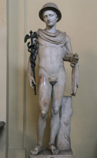 Statue of Hermes wearing the petasus (round hat), a voyager's cloak, the caduceus and a purse. Marble. Roman copy after a Greek