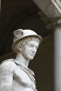 Vatican, Italy - October 31, 2015:  Hermes Ingenui Hermes wears his usual attributes: kerykeion (or herald's staff), kithara, petasus (round hat), tra