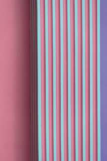 vertical pink green purple striped concrete or cement wall architecture abstract background