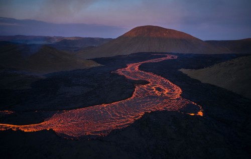 Flowing lava in volcanic mountains