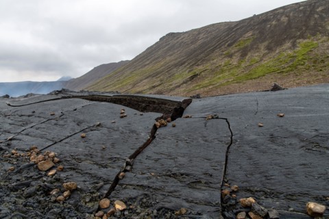 Close up view of cracked lava crust or ingenious rock, cooled down from 2021 eruption of volcano Mt. Fagradalsfjall in Geldingadalir valley on Reykjan