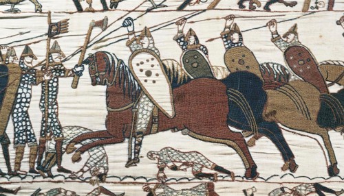 BAYEUX TAPESTRY Mounted Norman cavalry attack King Harold's foot soldiers