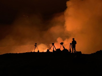 An Hawaiian Volcano Observatory geologist monitoring K?lauea ?volcano is erupting. Hawaii, USA. With the summit eruption continuing through the night, HVO scientists monitor the eruption for changes i...
