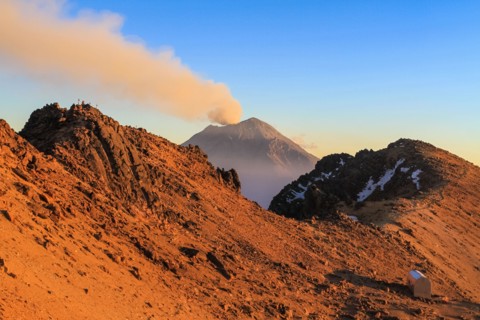 Evening on the slope of Iztaccihuatl volcano viewing the smoking Popocatepetl, Mexico