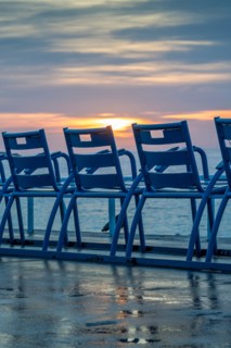 Picturesque blues chairs on the Promenade des Anglais in Nice on the French Riviera