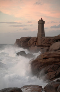 Lighthouse at Ploumanach on the Rose Granite coast Brittany France at Sunset