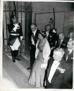 Apr. 04, 1957 - The Queen Attends A Candle-Lit Banquet At The Famous Louvre In Paris. Photo shows Wearing the red sash of the Legion of Honour over her brilliant Kingfisher blue-green dress, the Queen...