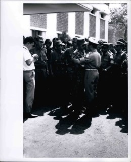 Feb. 28, 2012 - Grief stricken - Maj. General Suharto, newly appointed Army Chief of Staff in Indonesia, (in jungle suit) greets another officer at funeral services at Army Headquarters in Djakarta on...