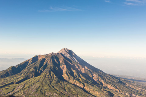 A view of Merapi volcano from the Merbabu volcano near the touristic city of Yogyakarta  in central  Java in Indonesia