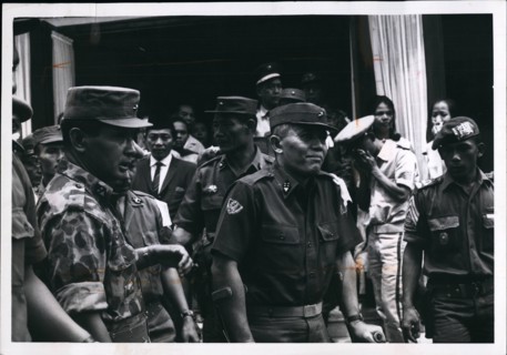 1965 - General Abdul Haris Nasuton, Centre, griefstricken, as he leaves his house in Djakarta for funeral of his 5-year-old daughter who was fatally wounded in the aborted communist coup of Oct 1, 196...
