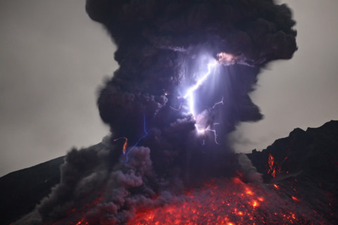 Japan, Kagoshima area - Sakurajima eruption with lightning. TRAVELLING a million-miles around the planet this photographer has completed his quest to show the alien side to the Earth. From celestial a...