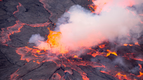 Lava bursts out of the worlds largest lava lake inside Nyiragongo in the Democratic Republic of Congo.  Taken 500 metres inside the active volcano.