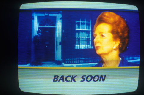 Mrs Margaret Thatcher as seen on ITN news, her resignation on 22 11 1990. Image 10 Downing Street background. Inset portrait of the Prime Minister, commercial advertising beak  "Back Soon". 1990 1990s...