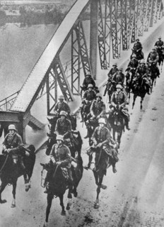 Black and white photo of the German cavalry crossing the Rhine River in the reoccupation of the Rhineland.