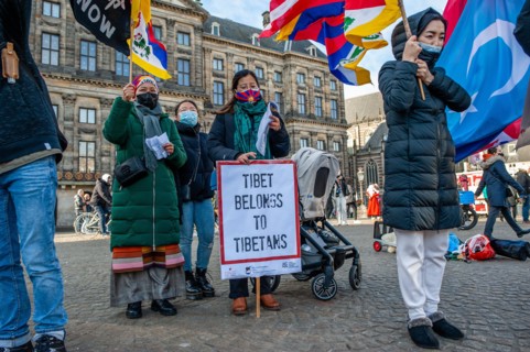 A woman is seen holding a placard in support of the Tibet during the demonstration. The Tibetan community in The Netherlands organized a demonstration against the celebration of the Olympic Games in B...