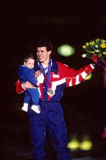 Dan Jansen (USA) with  his baby daughter after winning the gold in the 1000 meters speed skating event.
