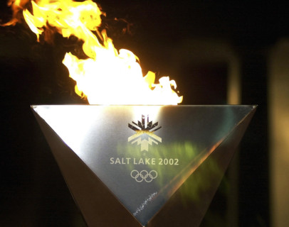 The 2002 Winter Olympic Games cauldron burns at the Lincoln Memorial in Washington, D.C., symbolizing the opening of the international multi-sport event held in Salt Lake City, Utah.