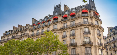 Eiffel tower between Parisian tenement old street alley and buildings, Paris